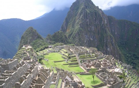 Machu Picchu is an ancient Inca city, located 2500 m above sea level, on a mountain ridge dominating the Urubamba river valley; a World Heritage Site and a place of tourist pilgrimage