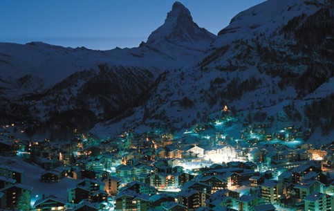 Zermatt is an idylic town surrounded with mighty mountains. Traditional Alpine architecture; stone-paved narrow streets without autos; hotels, restaurants and cafes with world name